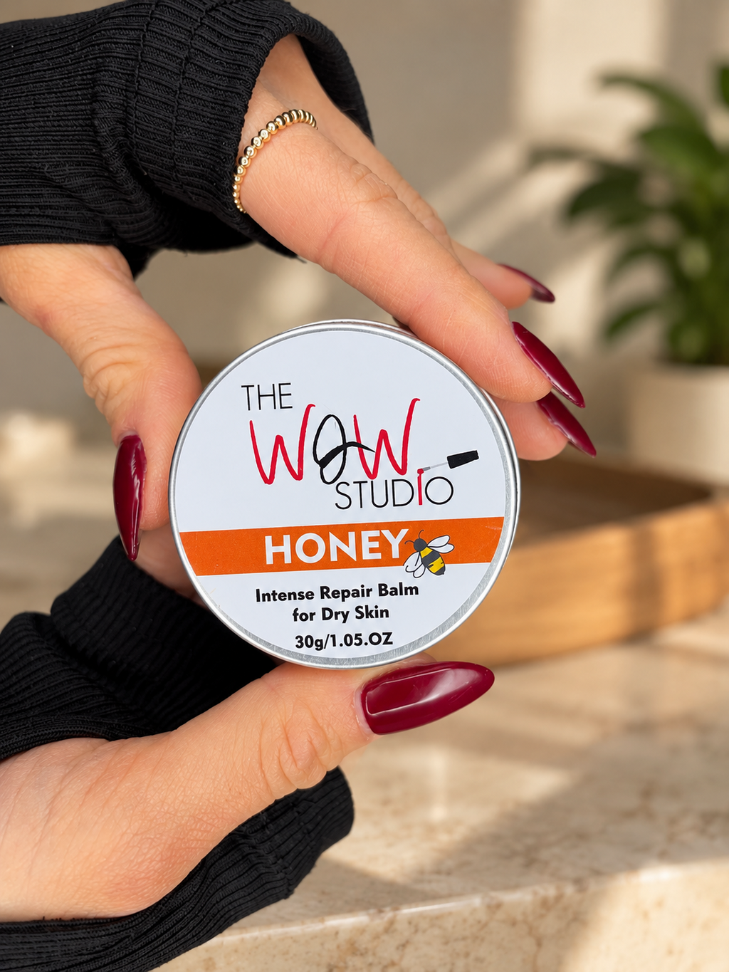 The WOW Studio Honey Intense Repair Balm held in hand